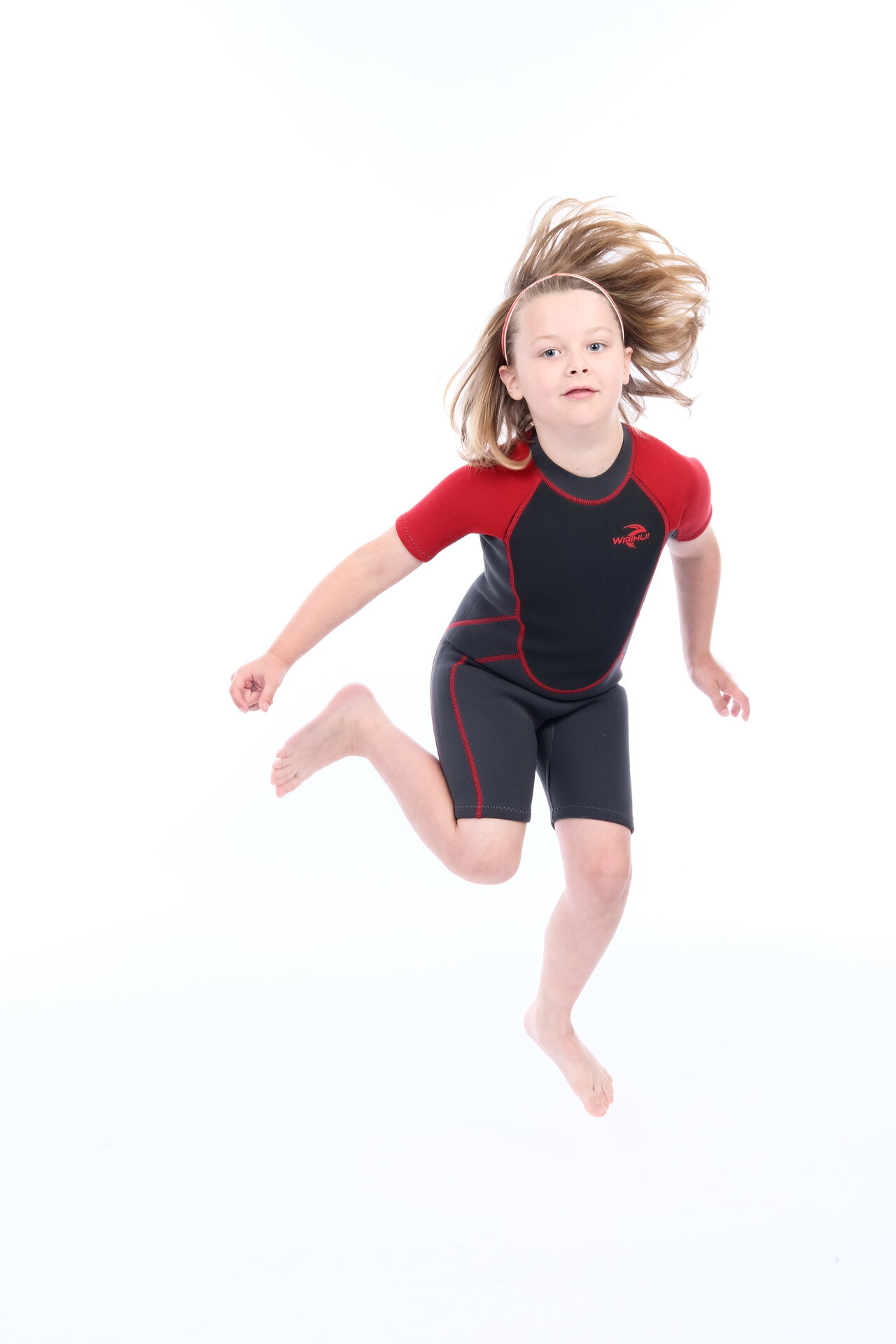 George Rouse dynamic action shot in red and black athletic wear